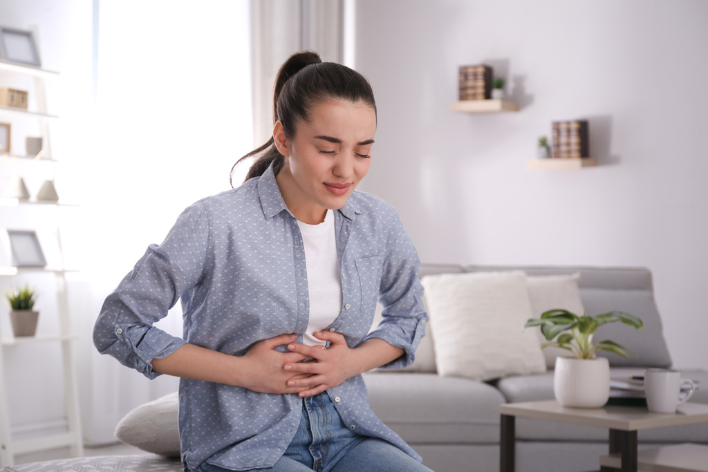 Young Woman With Pain Caused By IBS