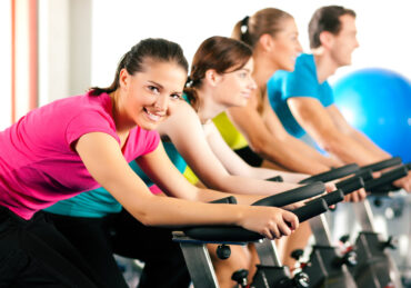 A Group Exercising on Bikes